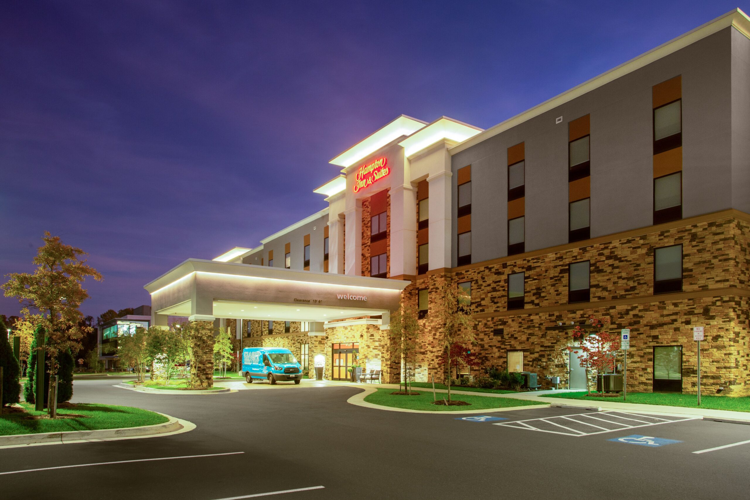 Hampton Inn & Suites property exterior at dusk